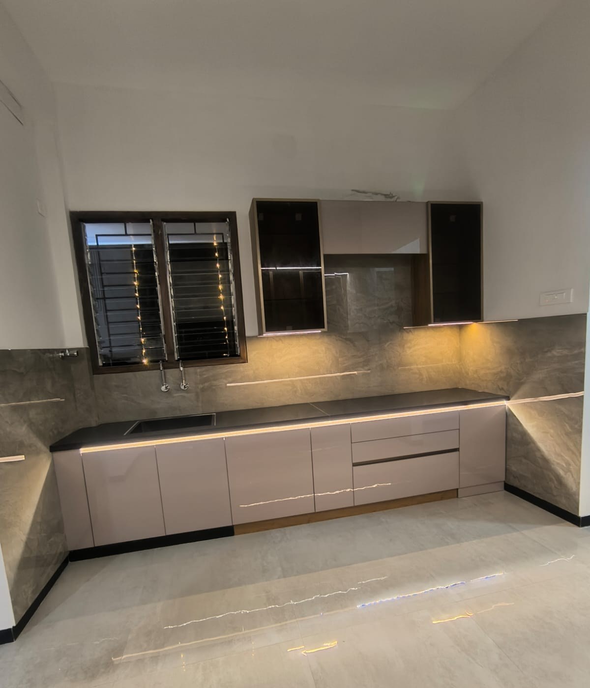Champagne gloss modular kitchen with LED lighting