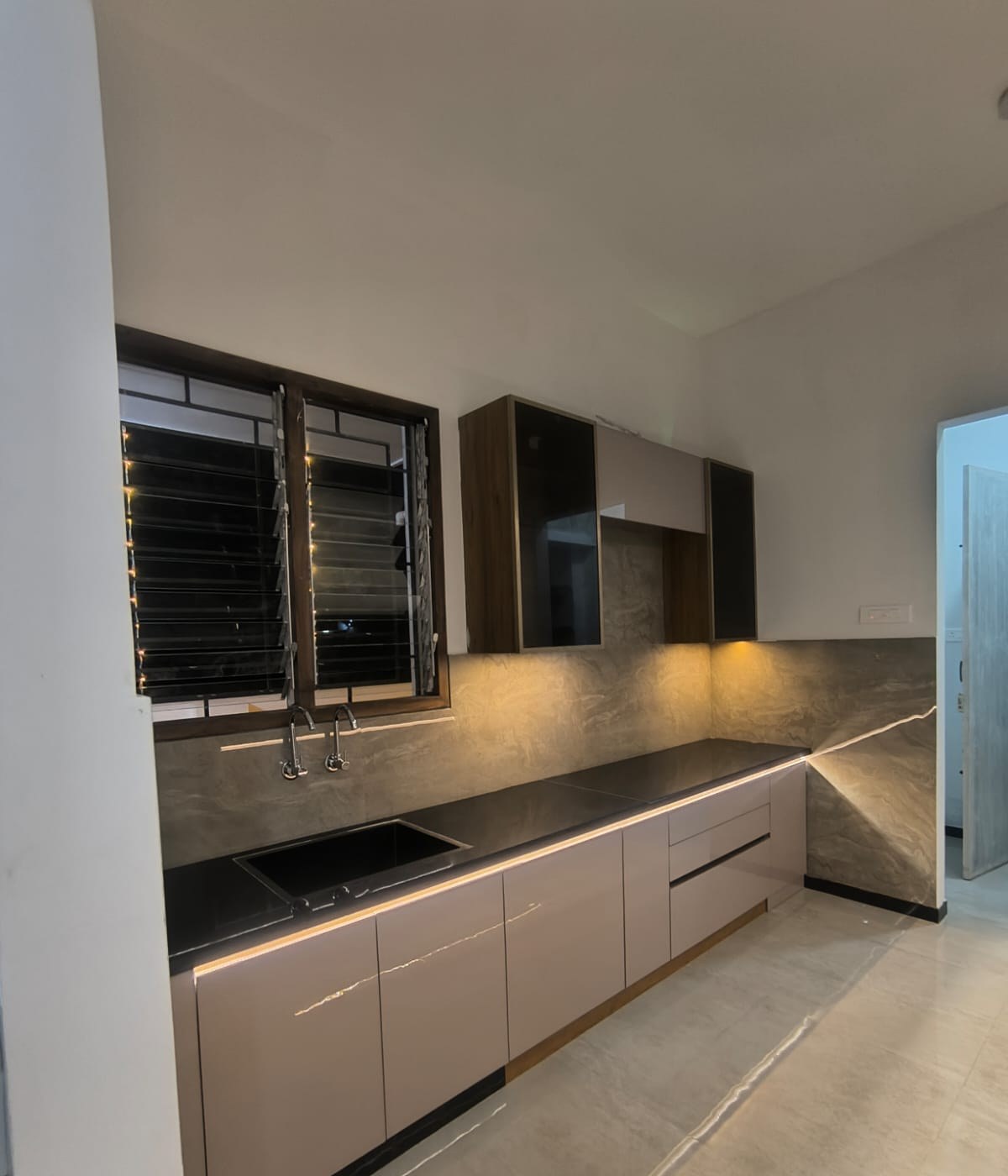 Kitchen sink run with under-cabinet LED lighting